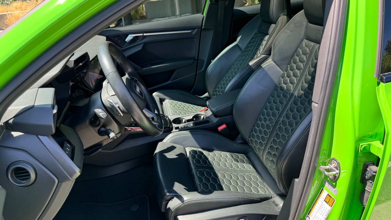 Cabin of the Audi RS 3 with honeycomb-stitched sports seats