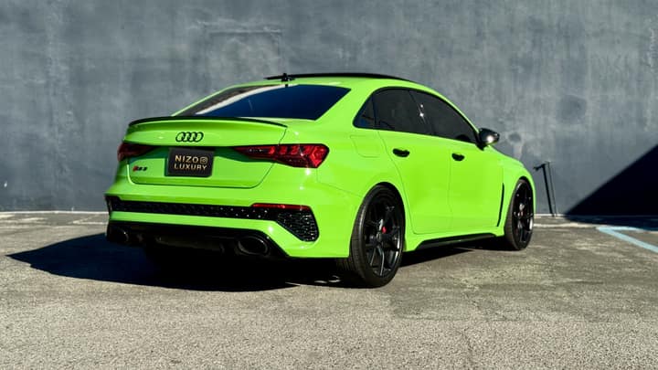Green Audi RS3 rental in Los Angeles, rear three-quarter view