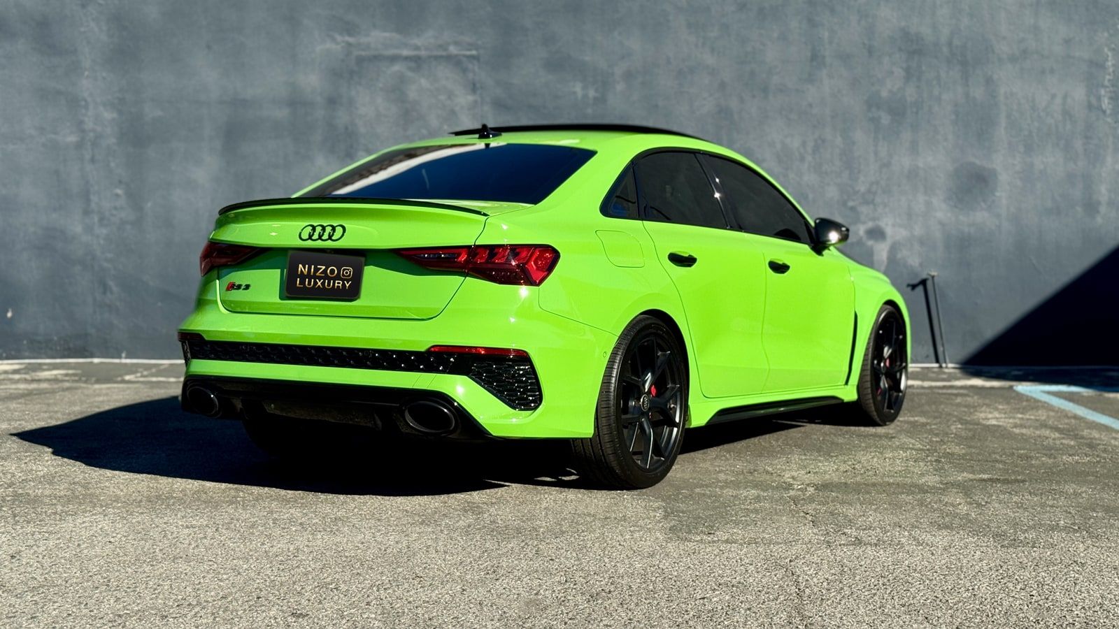 Green Audi RS3 rental in Los Angeles, rear three-quarter view