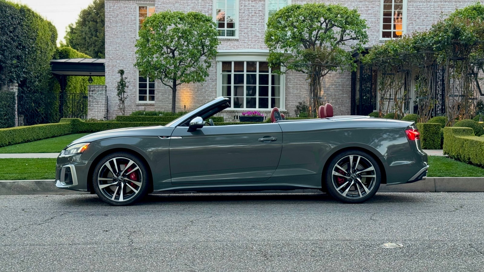 Grey Audi S5 Cabriolet in profile with the roof down