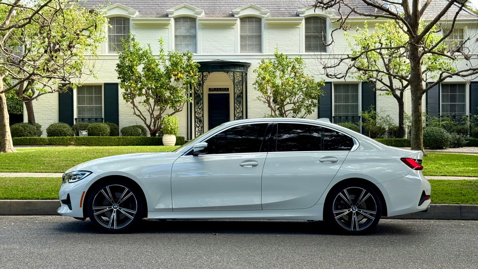 White BMW 3 Series in profile
