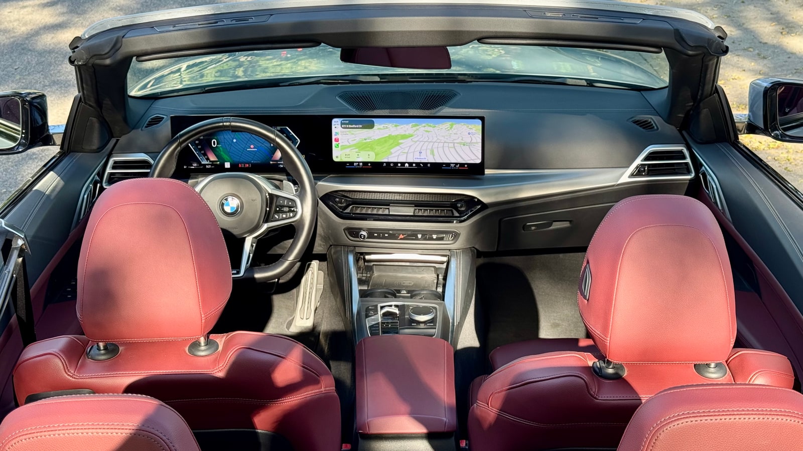 Four red leather seats of the BMW 430i Convertible