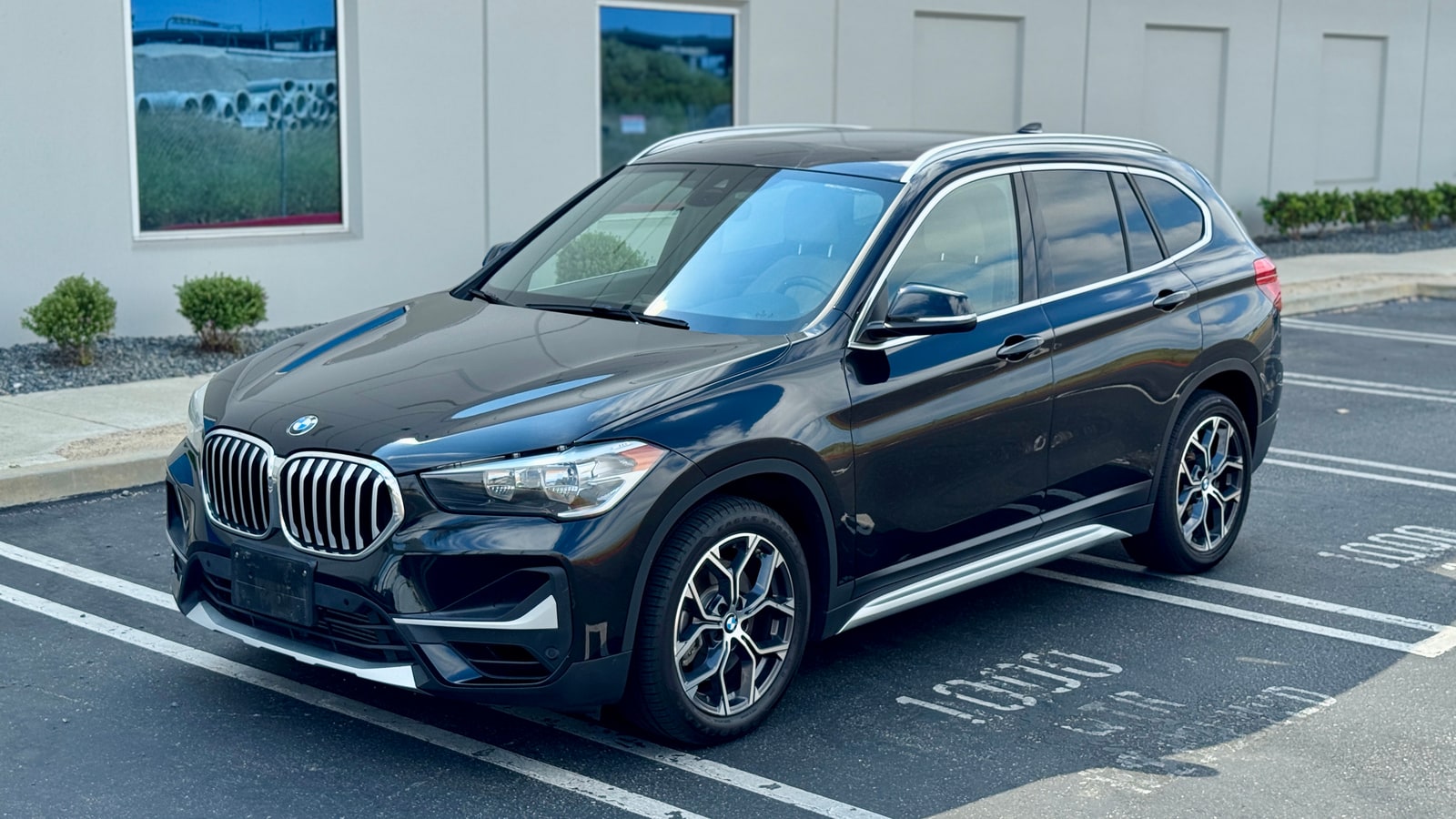 Black BMW X1 from a front three-quarter