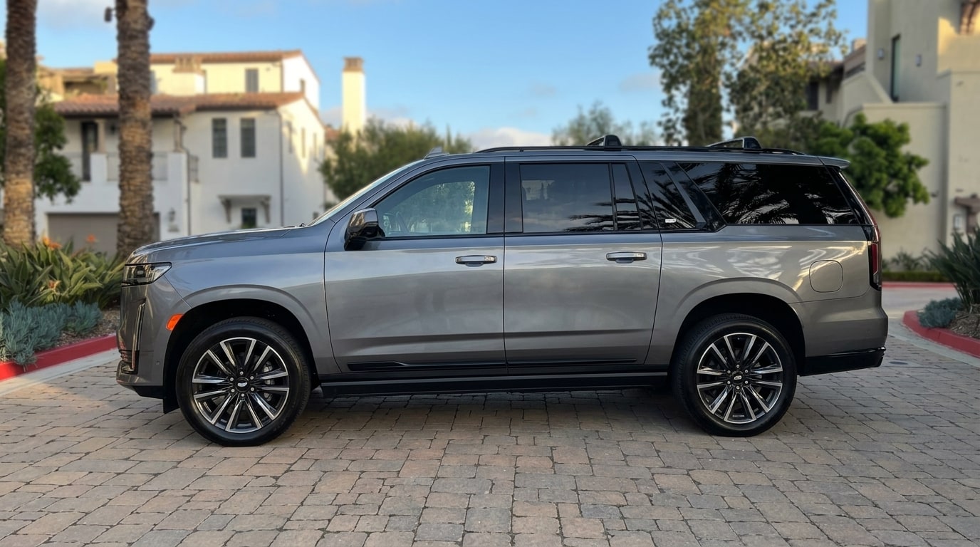 Grey Cadillac Escalade ESV in profile, showing the long-wheelbase body