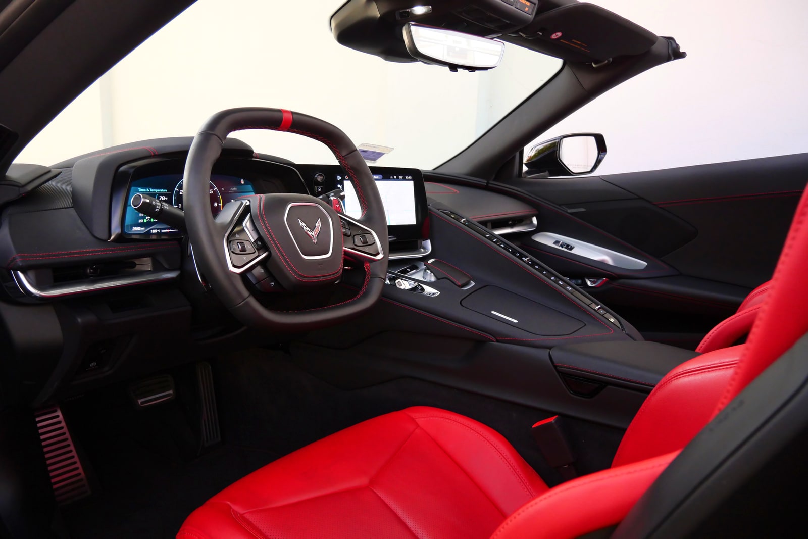 Squared steering wheel and red interior of the Chevrolet Corvette