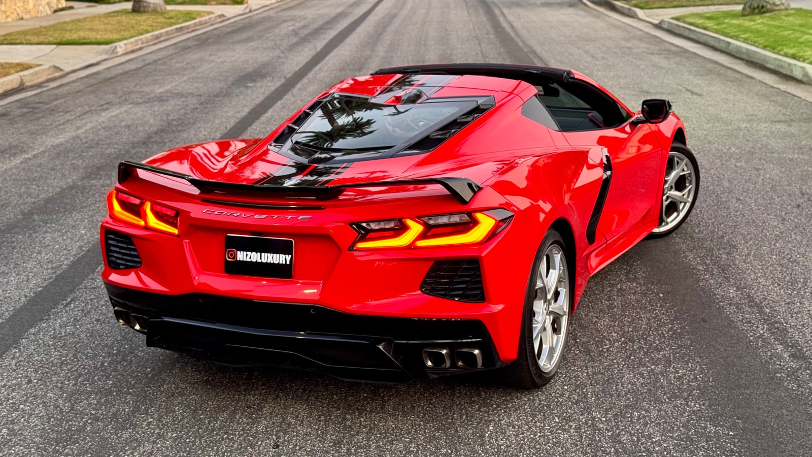 Red Chevrolet Corvette Convertible from above and behind with the roof stowed
