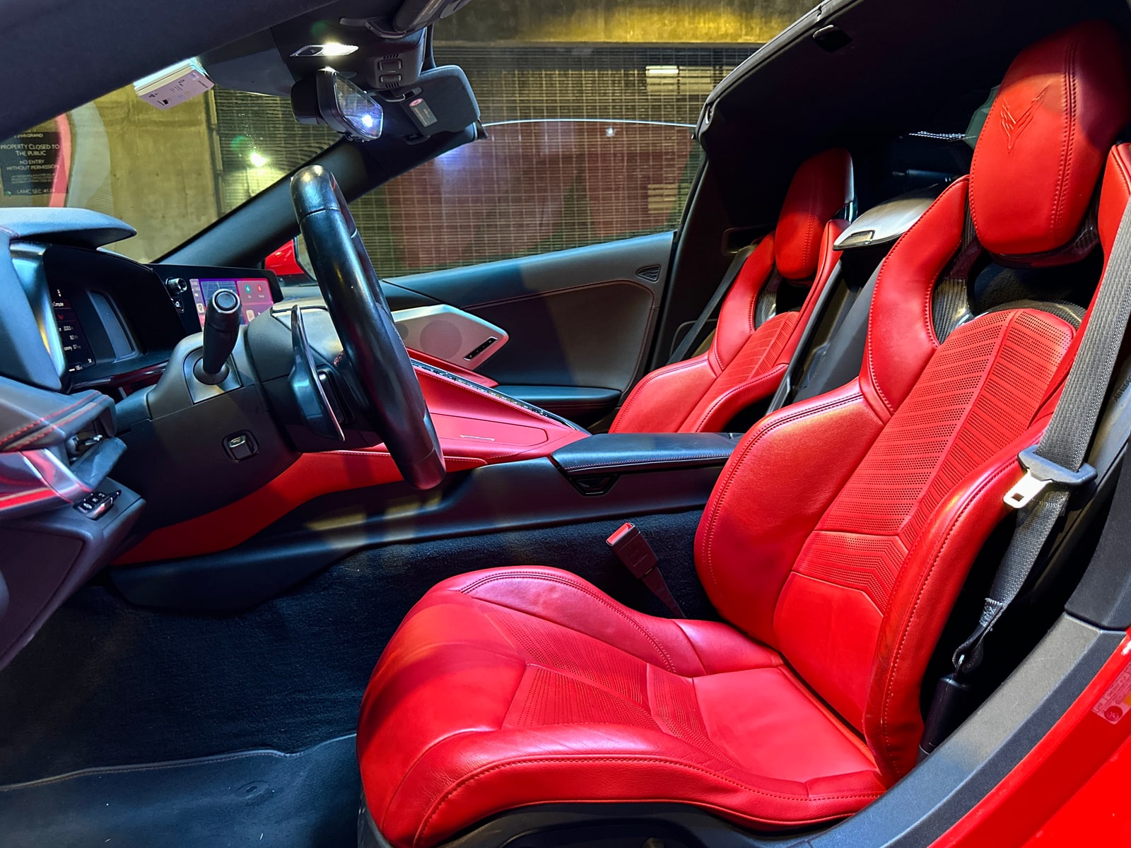 Red leather cabin of the Chevrolet Corvette Convertible with the roof removed