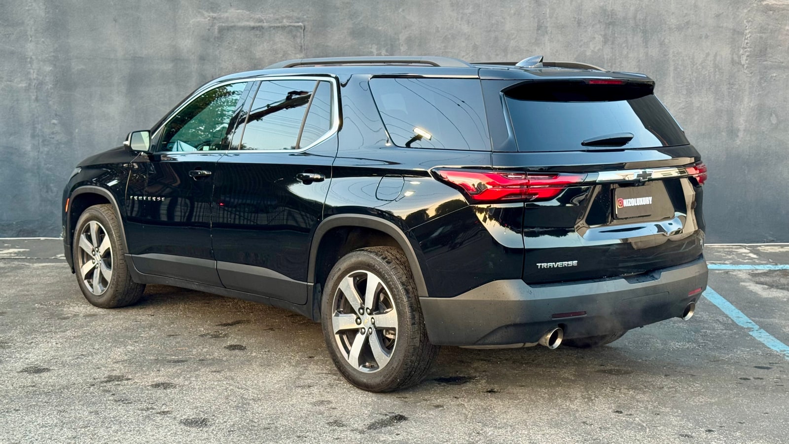 Black Chevrolet Traverse from the rear three-quarter
