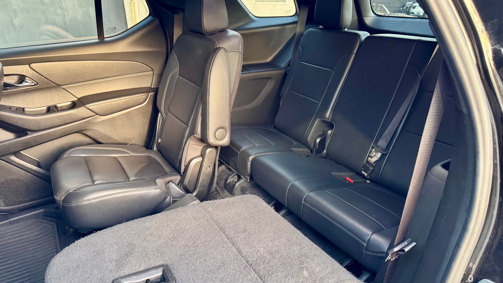Second and third row seats of the Chevrolet Traverse in black leather
