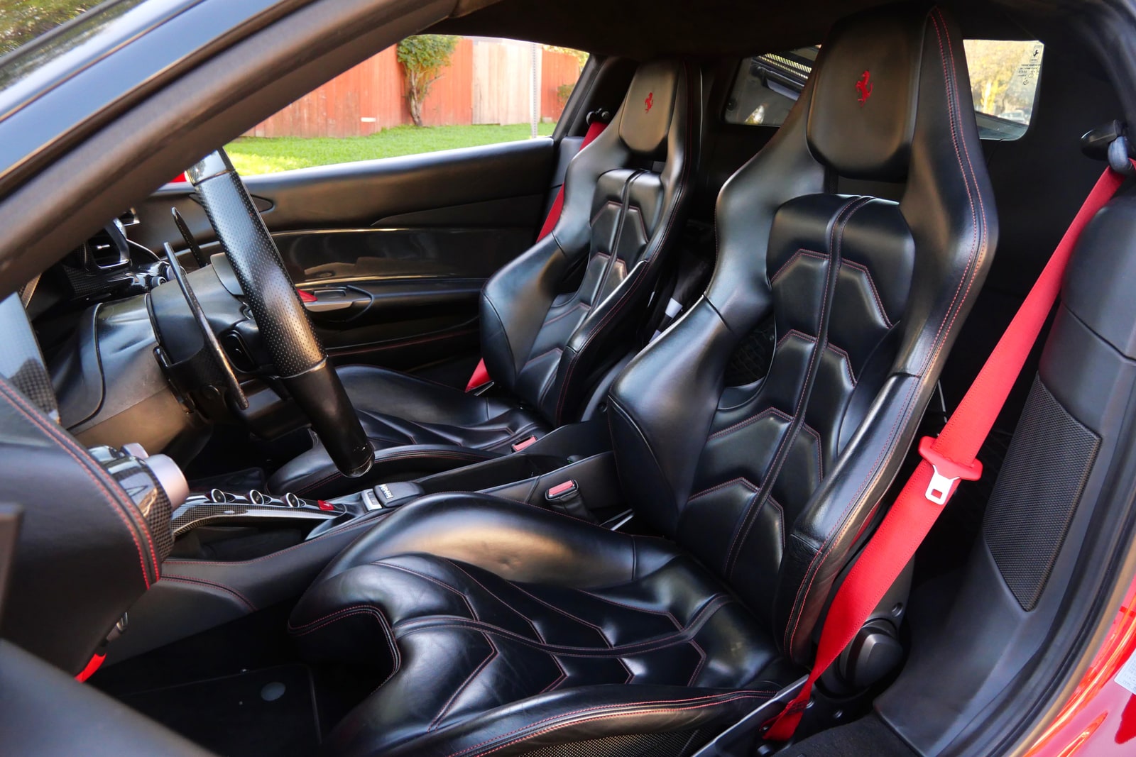Two-seat cabin of the Ferrari 488 GTB in black leather with red stitching