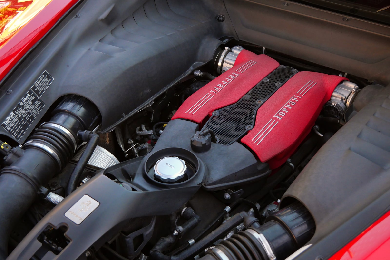 The 3.9-litre twin-turbo V8 of the Ferrari 488 under glass