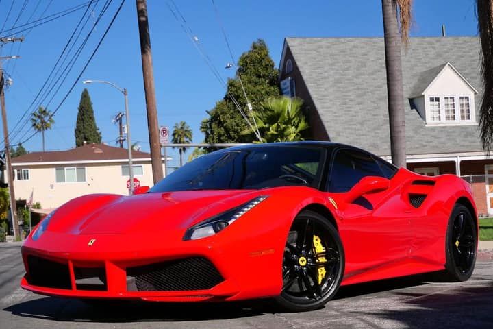 Red Ferrari 488 parked on a Los Angeles street