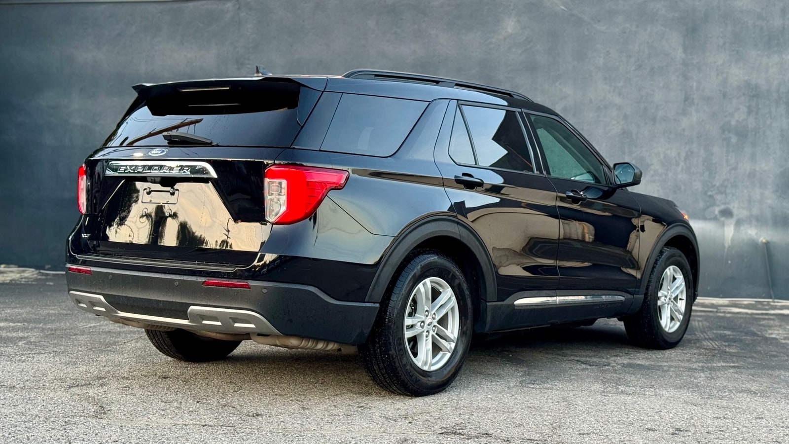 Black Ford Explorer from the rear three-quarter