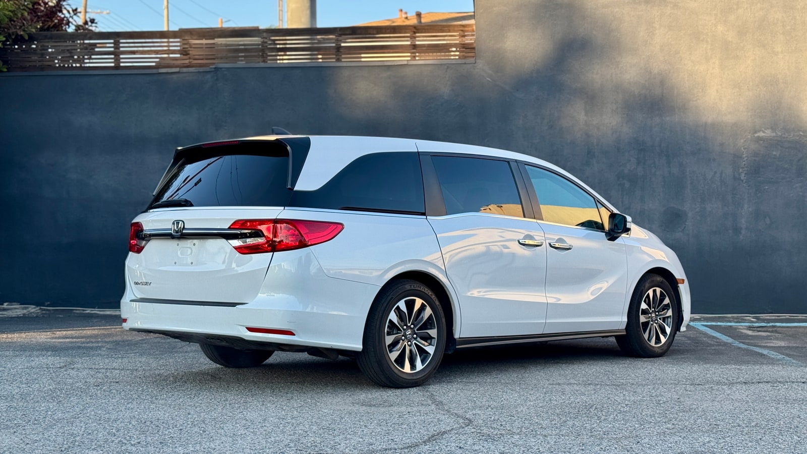 White Honda Odyssey from the rear three-quarter