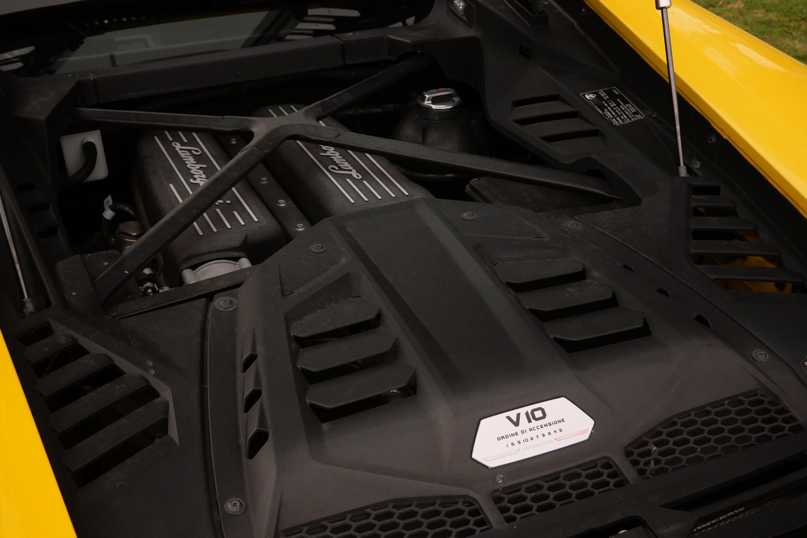 The 5.2-litre naturally aspirated V10 of the Lamborghini Huracán Evo under its cover