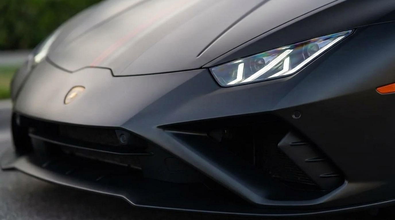 Y-shaped daytime running light on the nose of the matte black Lamborghini Huracan