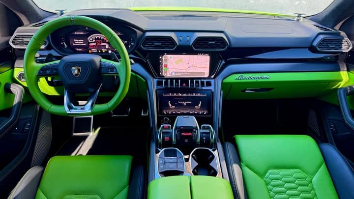 Green-trimmed dashboard of the green Lamborghini Urus