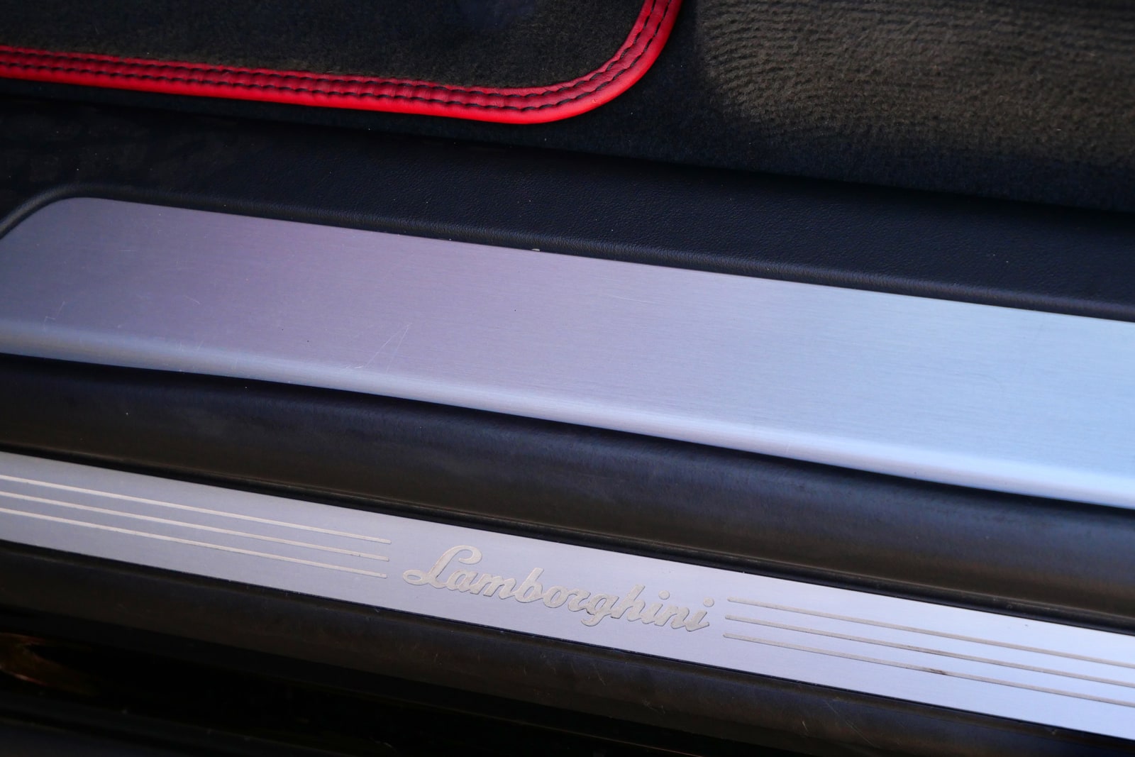 Lamborghini name milled into the door sill of the Urus