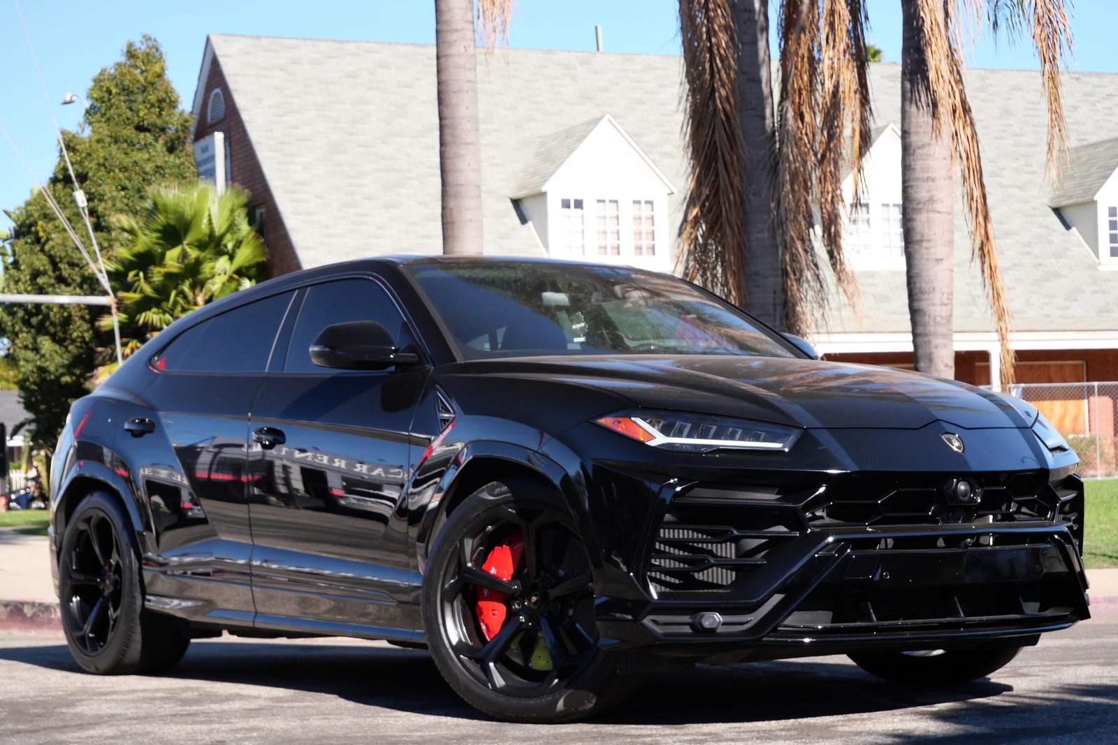 Black Lamborghini Urus at night in Los Angeles