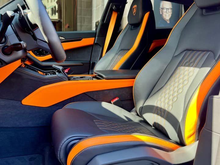 Hexagon-quilted orange and black seats in the Lamborghini Urus SE