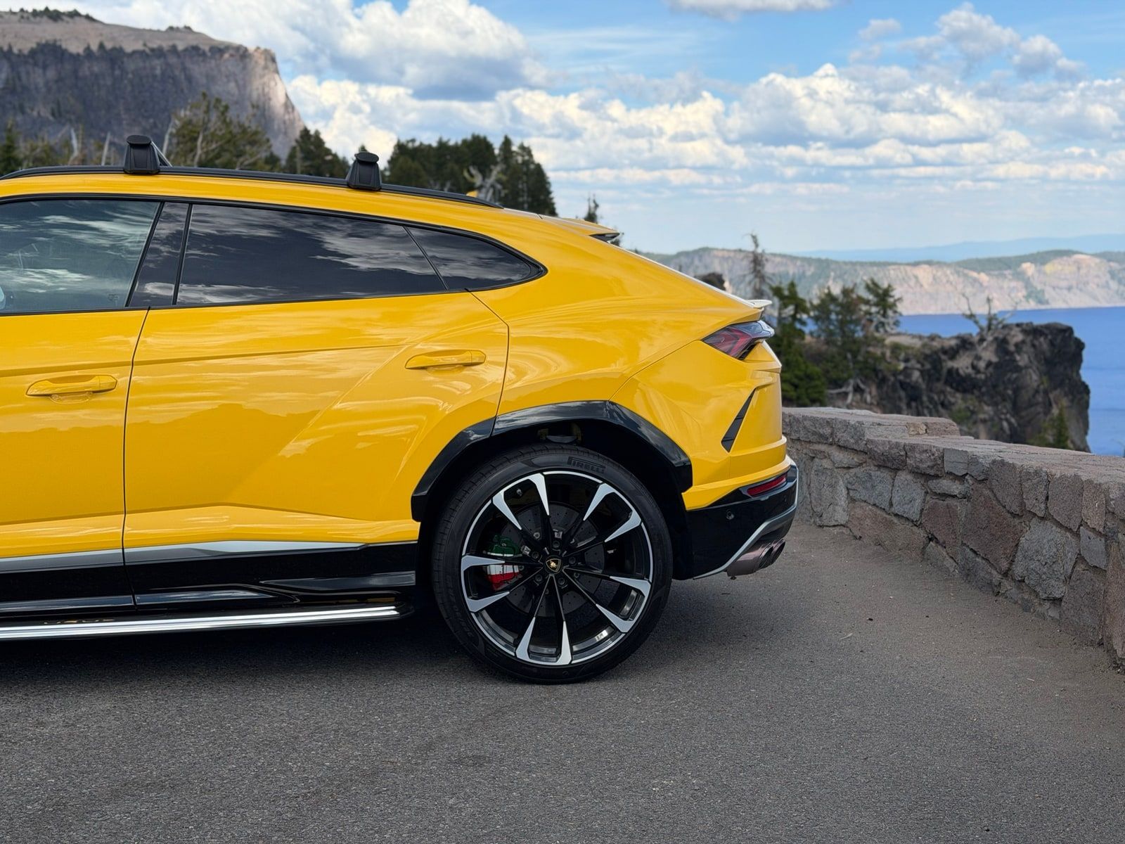 Yellow Lamborghini Urus waiting outside a house in Los Angeles