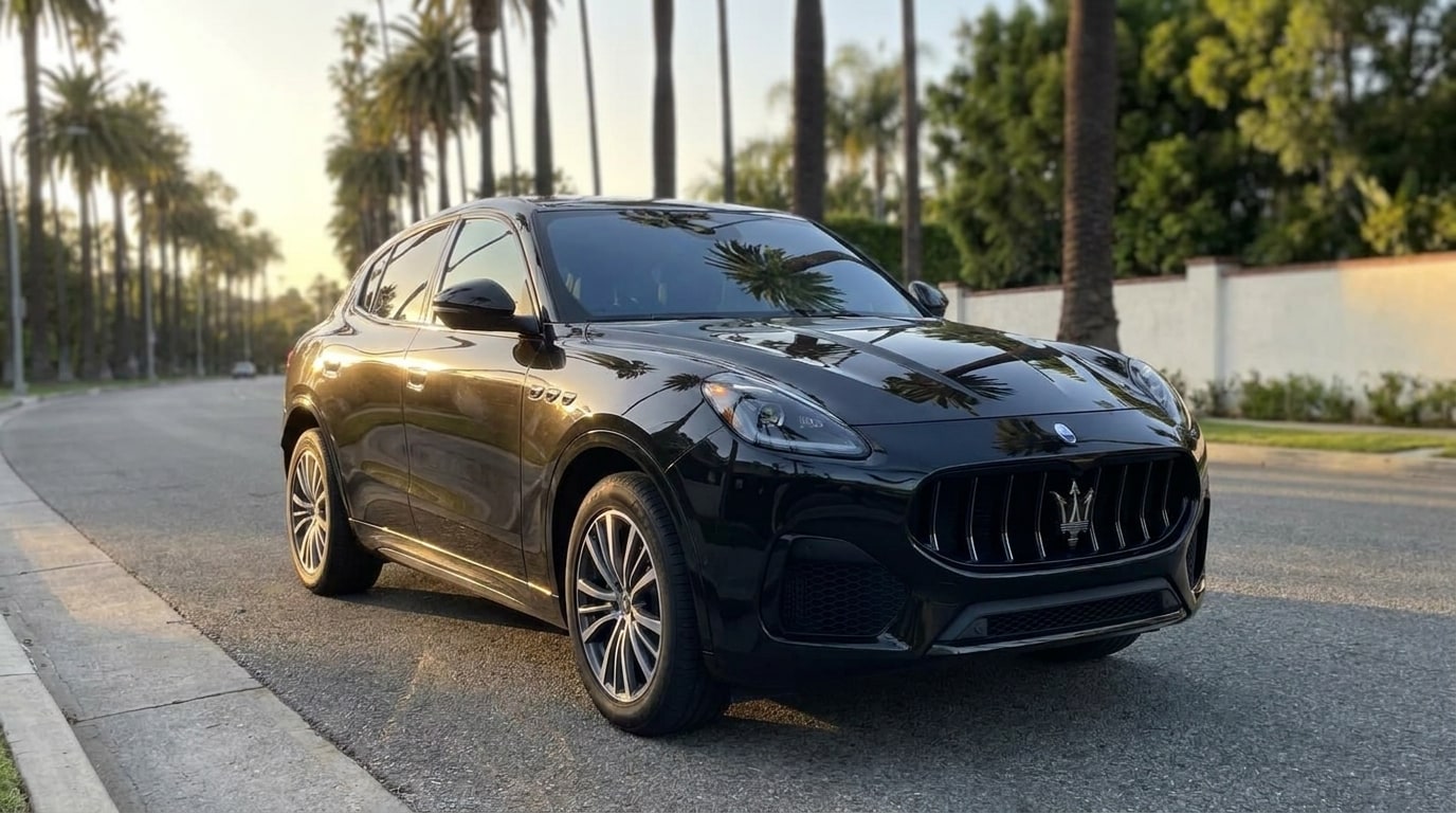 Black Maserati Grecale from a low front three-quarter on a palm-lined Beverly Hills street