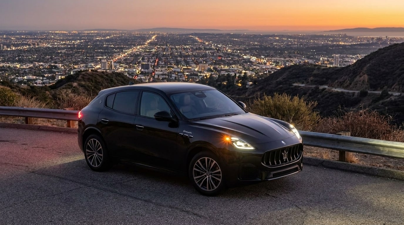 Black Maserati Grecale stopped on a canyon road above Los Angeles at dusk