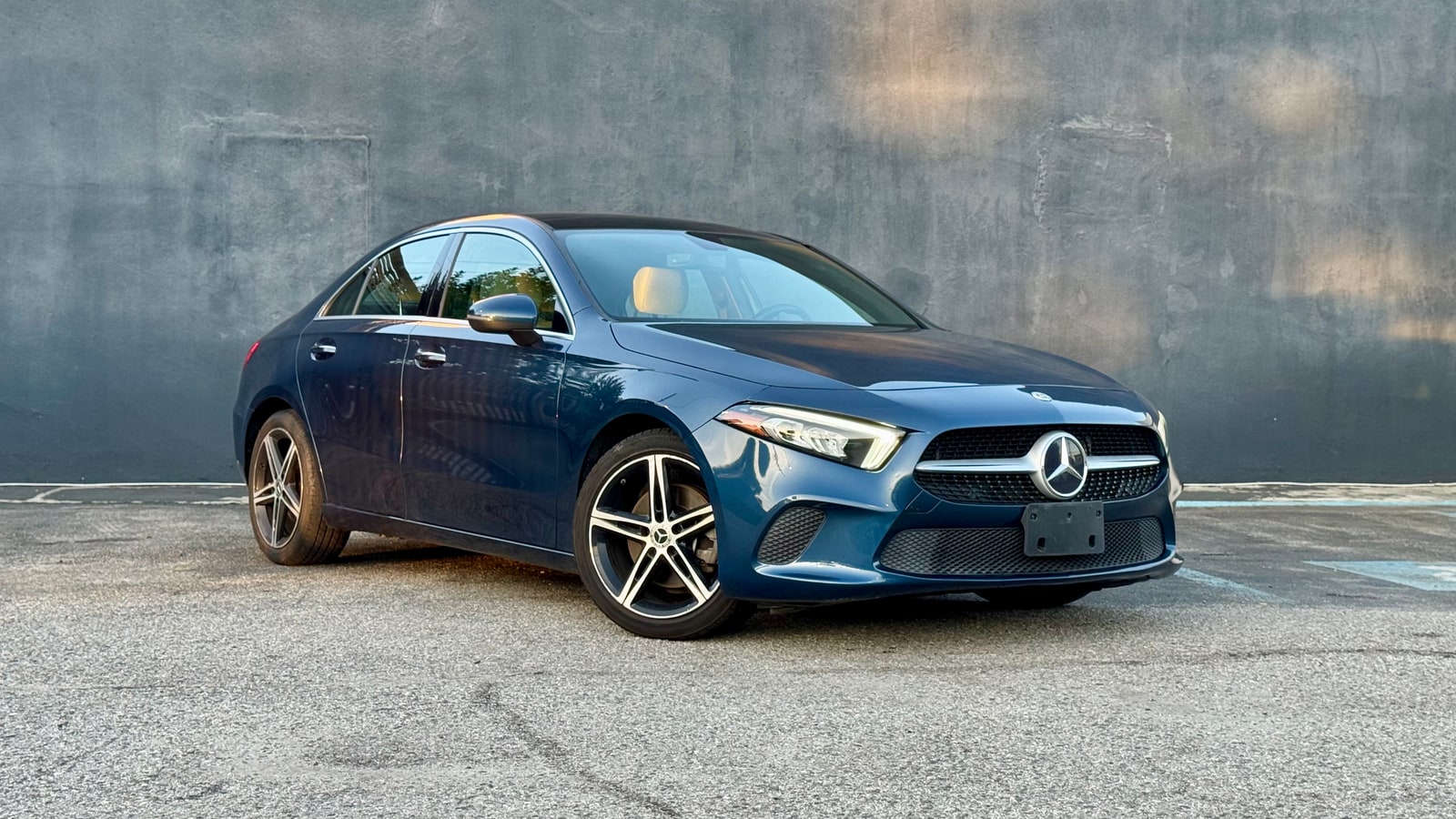 Blue Mercedes A220 from a front three-quarter
