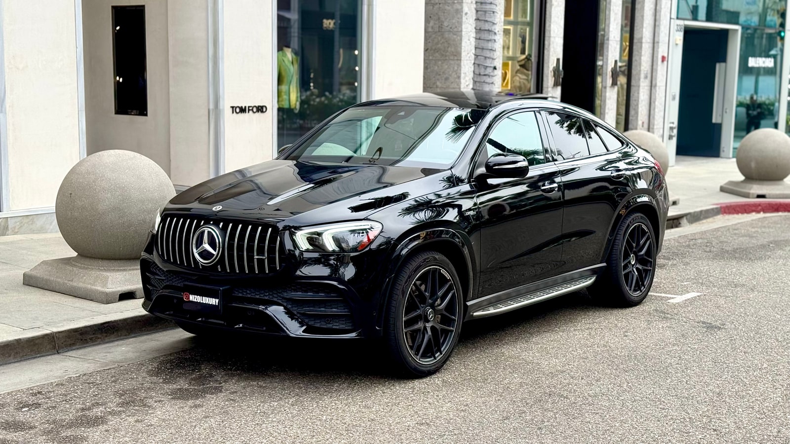 Black Mercedes-AMG GLE 53 rental parked on Rodeo Drive in Beverly Hills