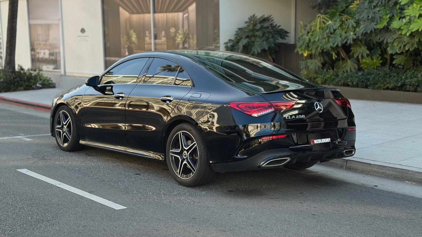 Black Mercedes CLA 250 from the rear three-quarter