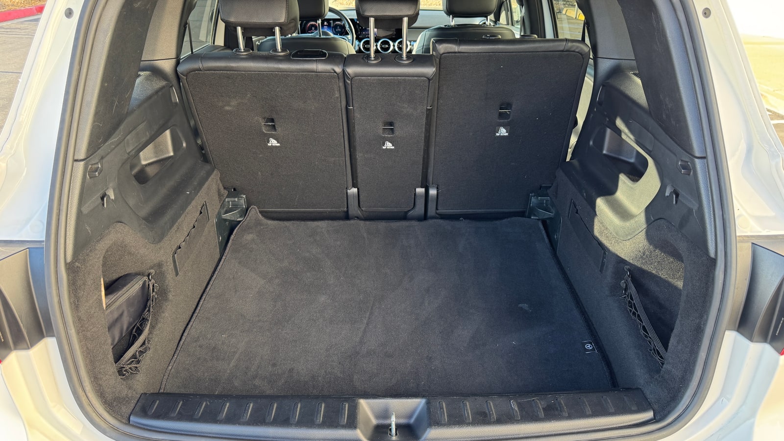 Open boot of the white Mercedes GLB with the seats folded