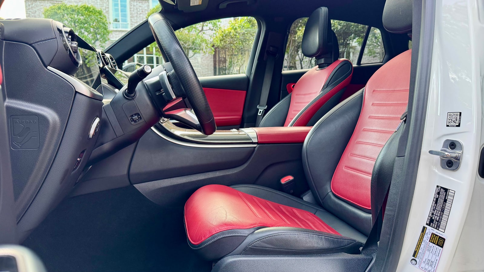 Red leather front seats of the white Mercedes GLC