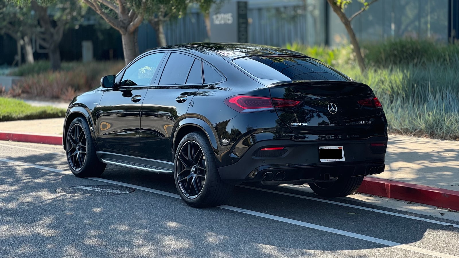 Black Mercedes-AMG GLE 53 from the rear three-quarter