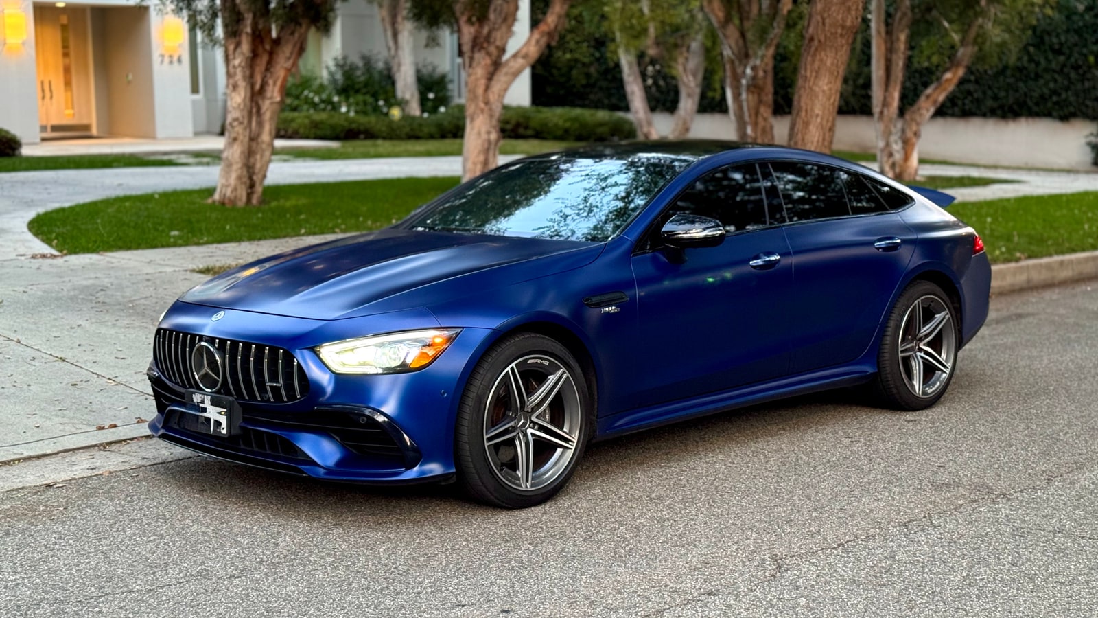 Blue Mercedes-AMG GT 43 from a low front three-quarter