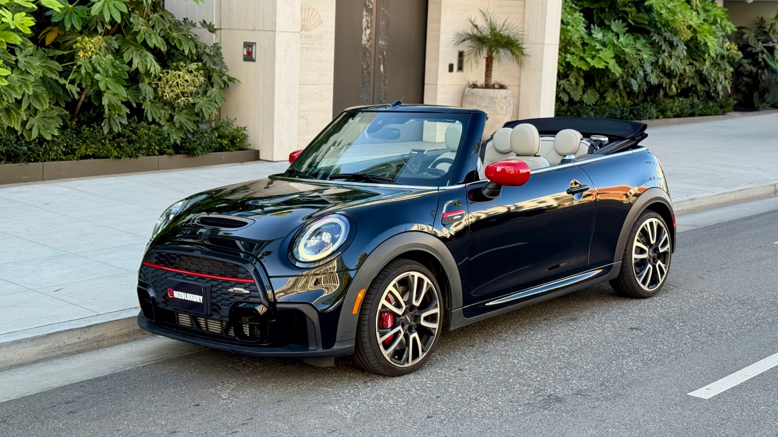 Black Mini Cooper Convertible with the roof down