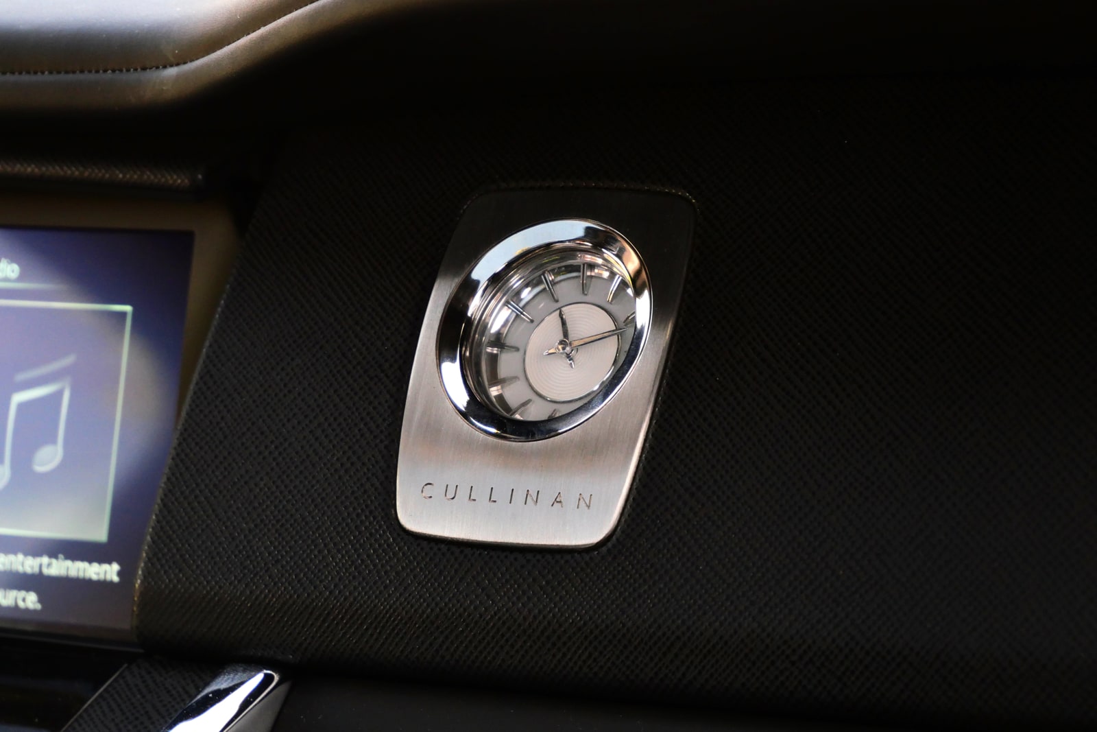 CULLINAN nameplate and analogue clock on the Rolls-Royce dashboard