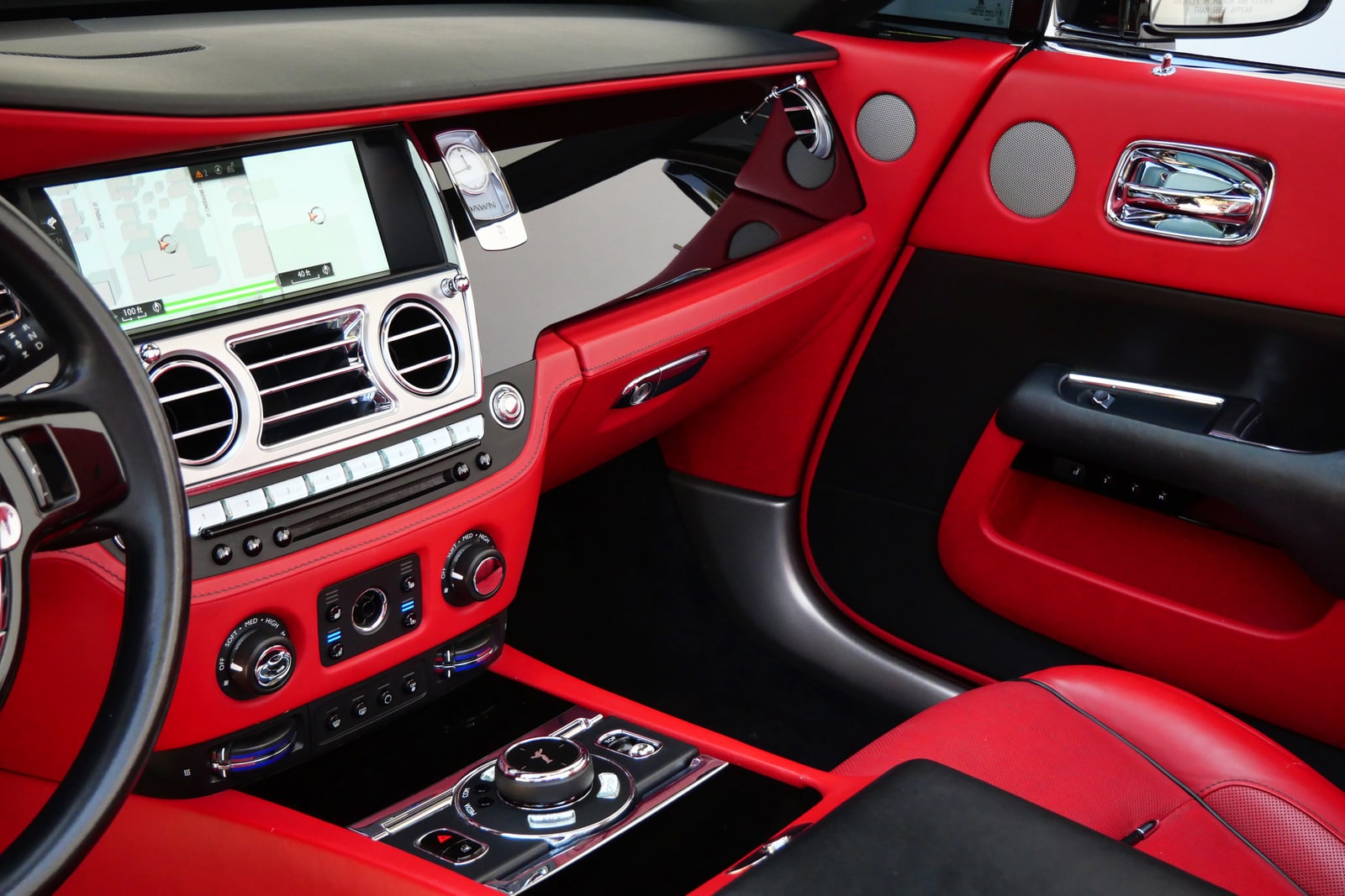 Centre console and controls of the Rolls-Royce Dawn in red leather