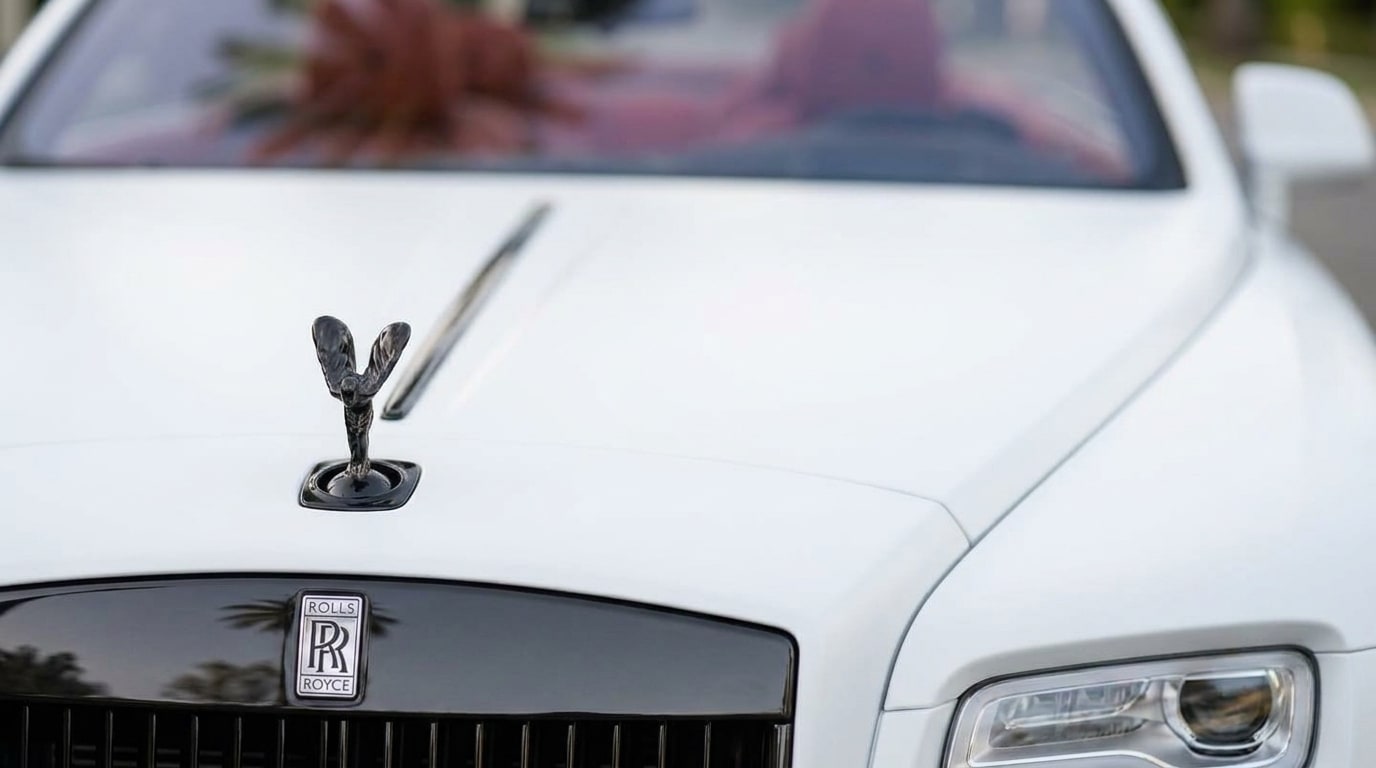Spirit of Ecstasy on the bonnet of the matte white Rolls-Royce Dawn