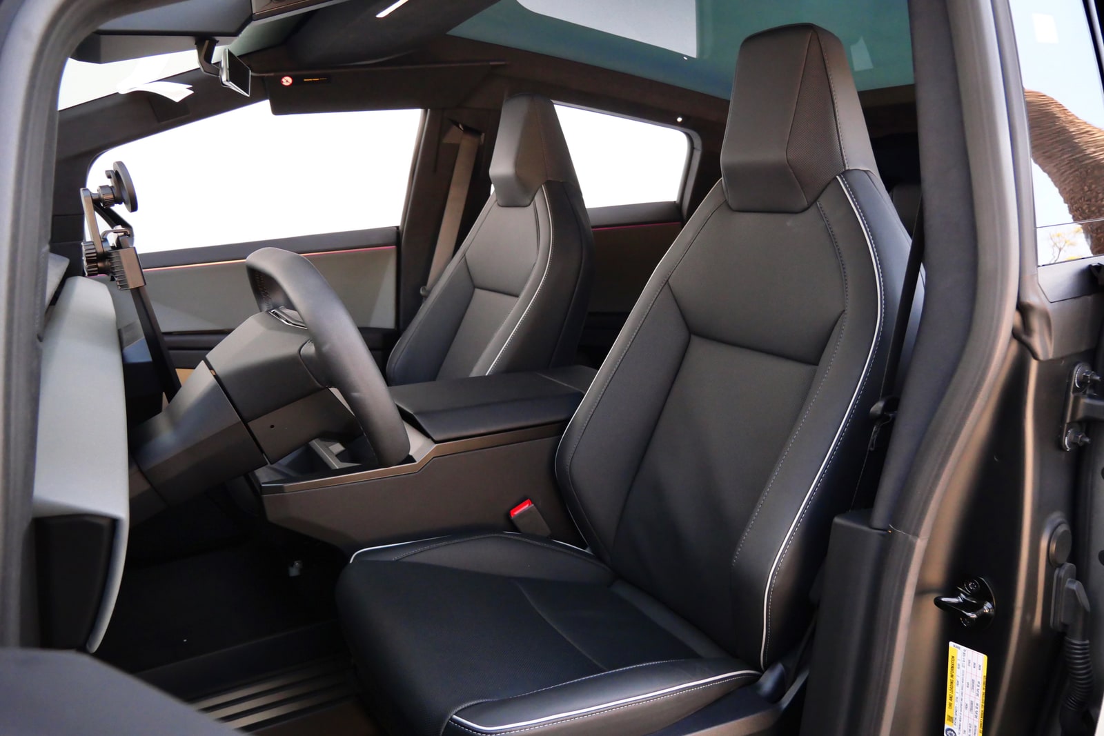 Cabin of the Tesla Cybertruck with front seats and glass roof