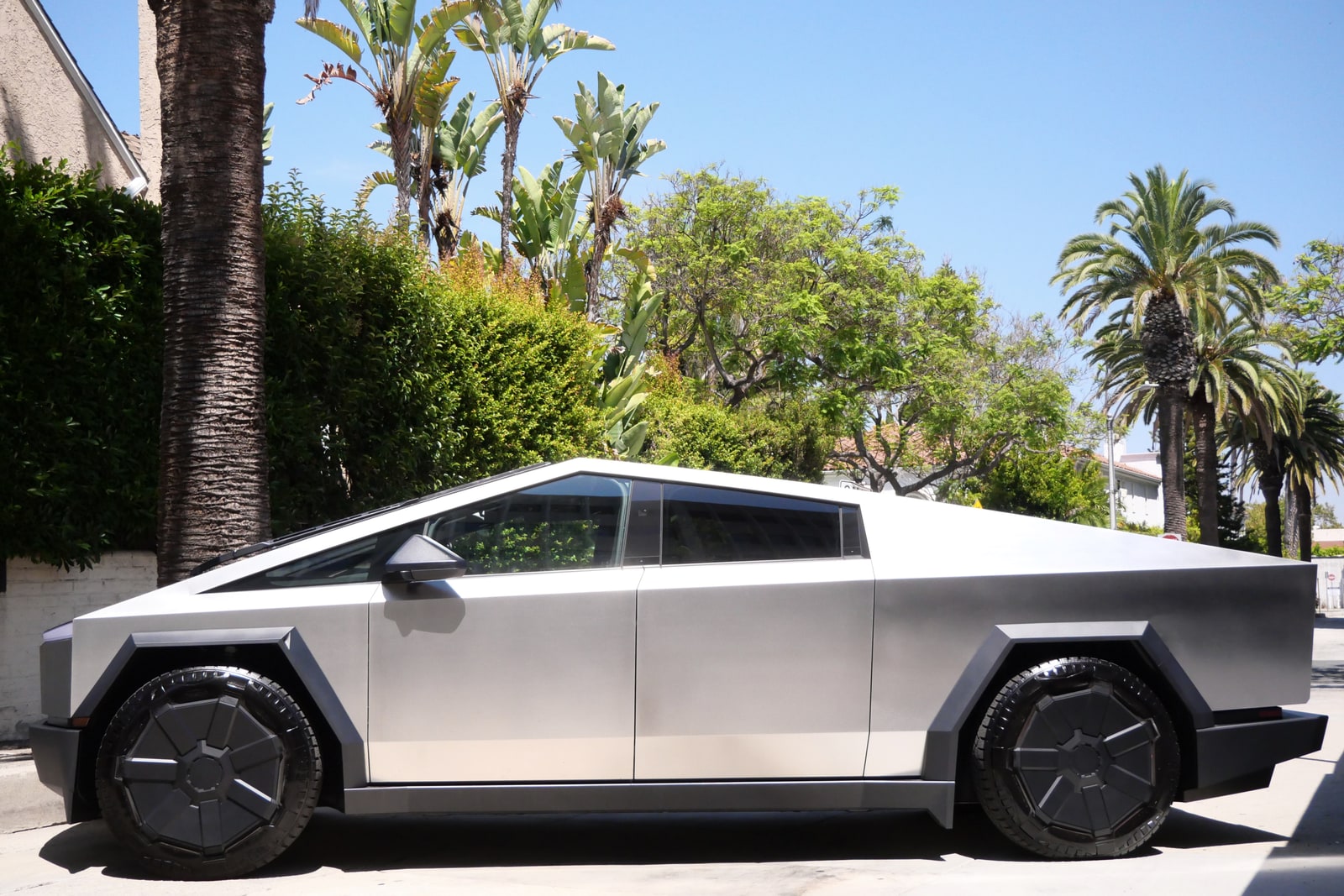 Tesla Cybertruck rental in profile on a residential street in Los Angeles