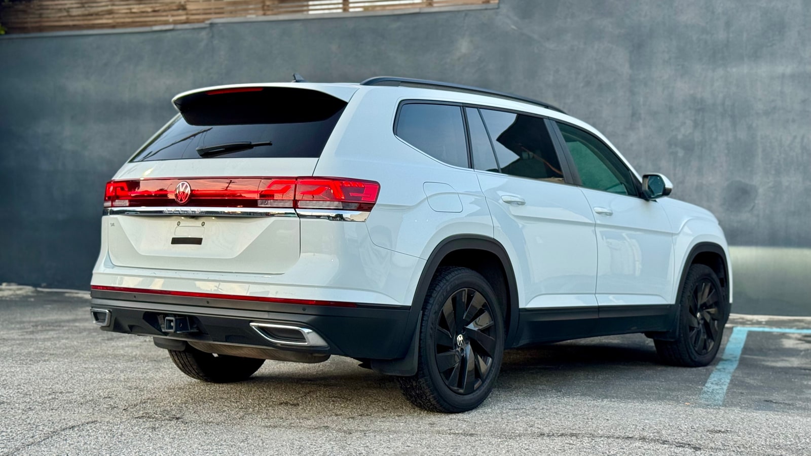 White Volkswagen Atlas from the rear three-quarter