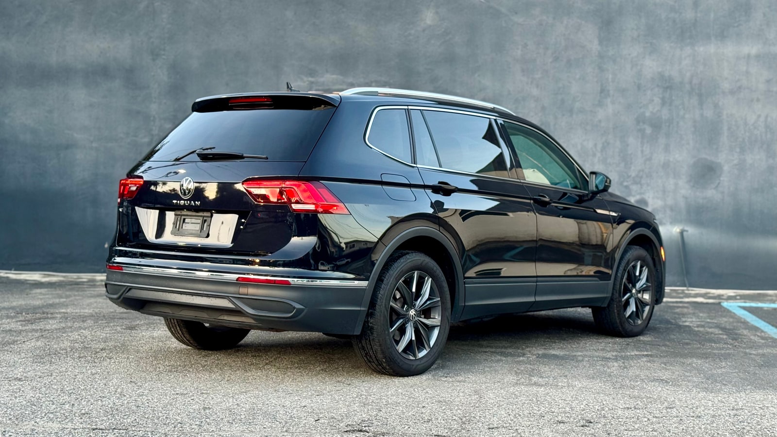 Black Volkswagen Tiguan from the rear three-quarter